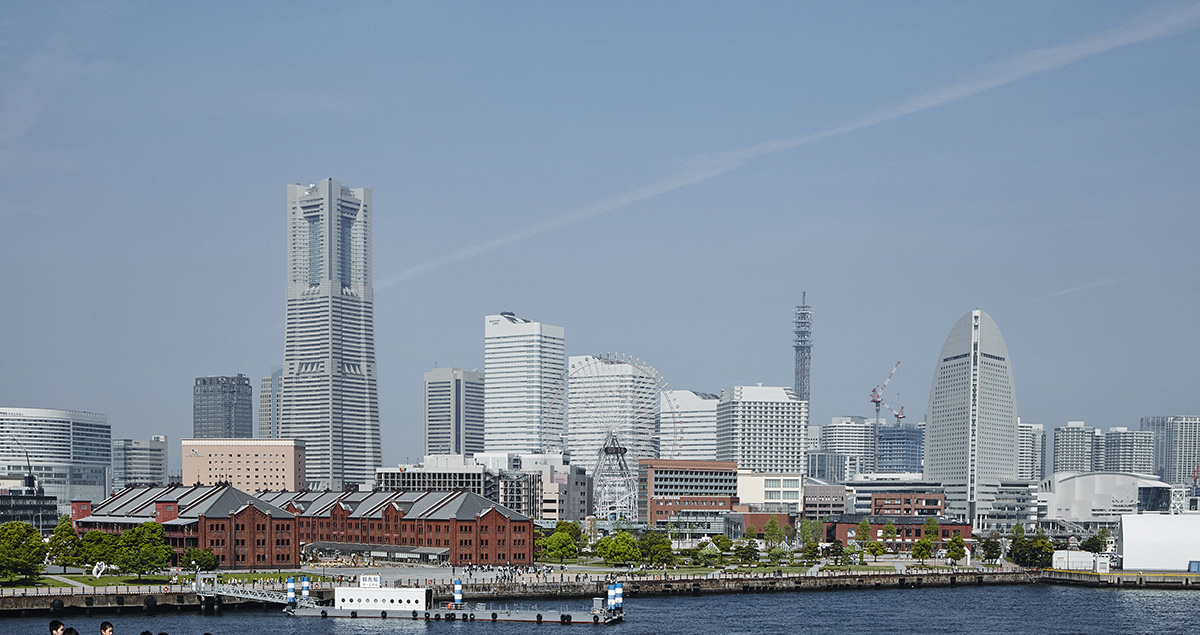 A view from Osanbashi Pier. Yokohama Red Brick Warehouse buildings, now a shopping center and site of seasonal festivals, and just a brief stroll from Minatomirai, contrast the past with the present and future.
