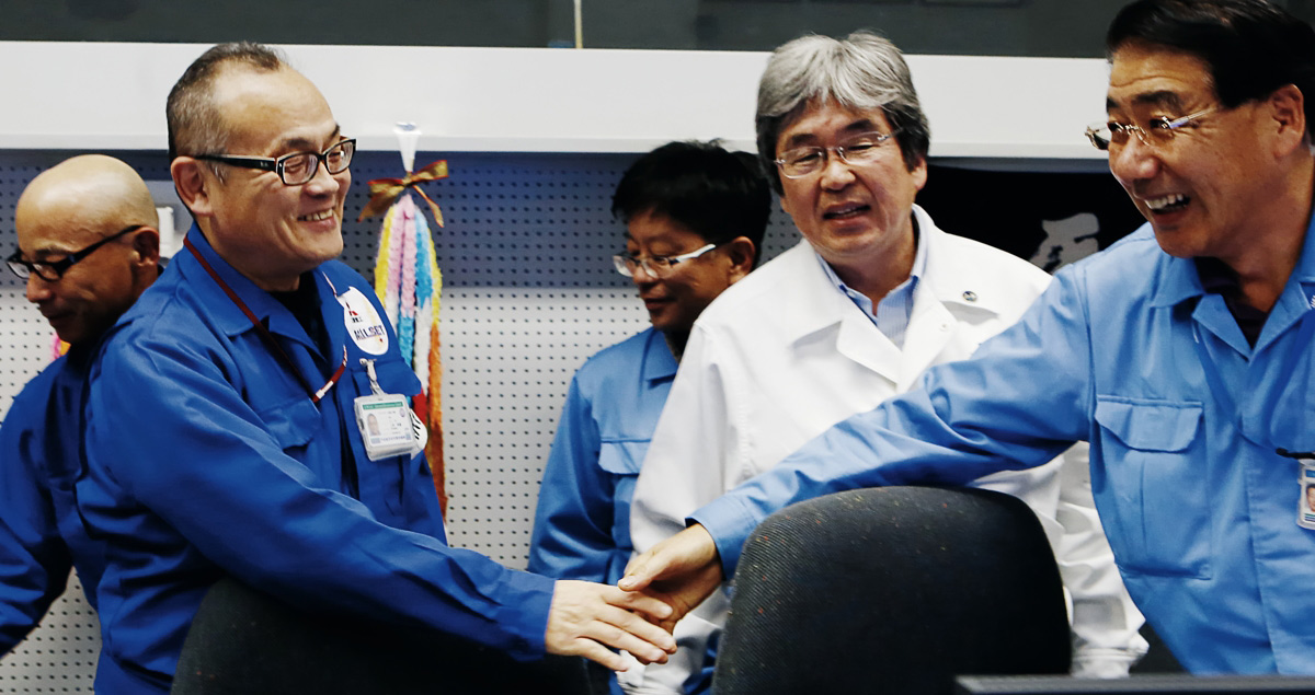 At 5:59 p.m. a successful launch is declared and the atmosphere immediately shifts to one of jubilation. Key members of the mission make their way to a press conference to field questions from the press.